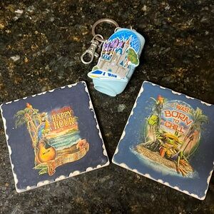 2 Rainforest Cafe coasters, one hand sanitizer keychain
